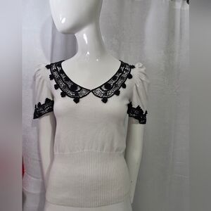 White Top with Black Lace Accents